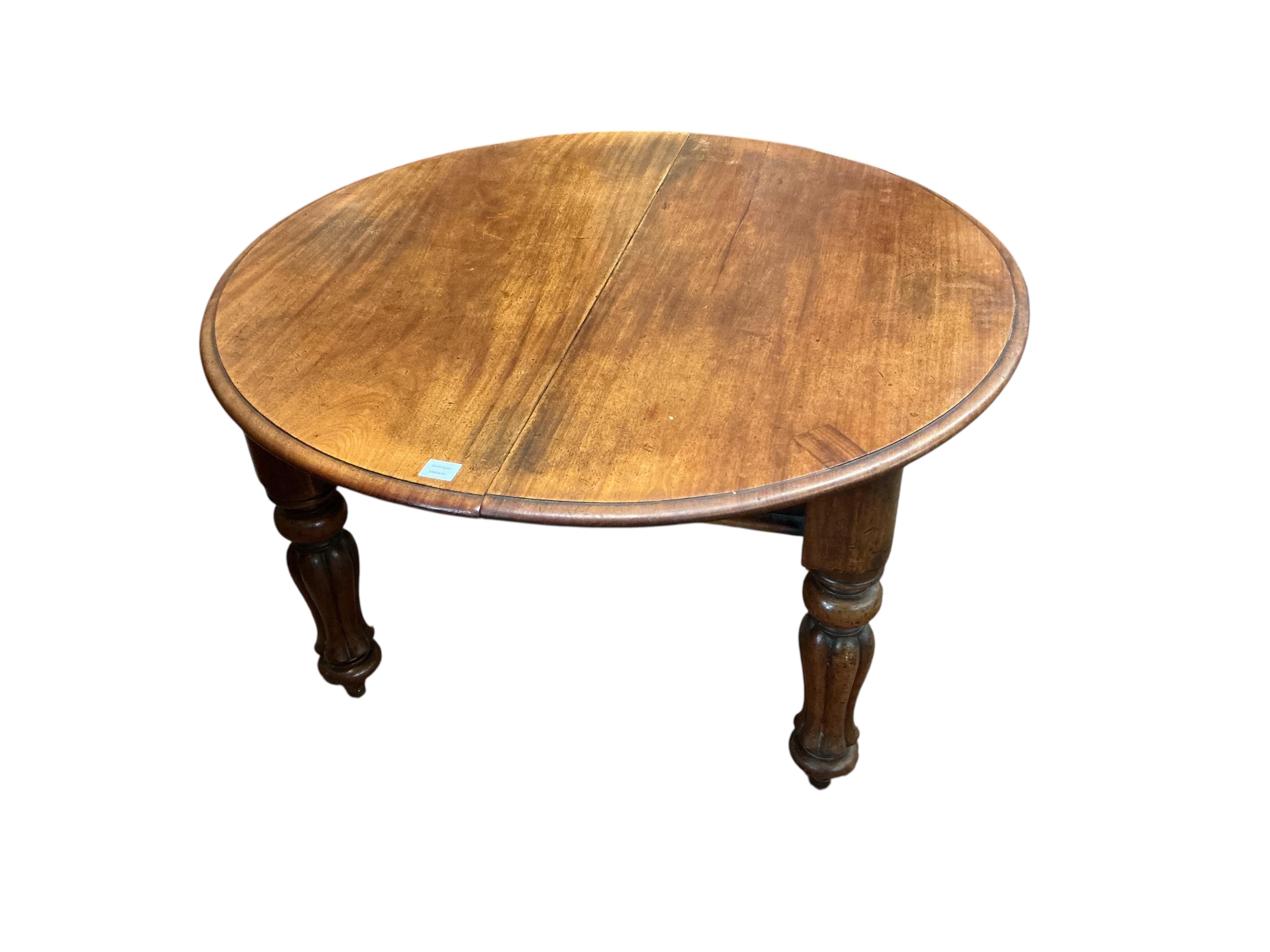 A Victorian mahogany extending dining table, 238cm extended, two spare leaves together with a harlequin set of six William IV mahogany dining chairs